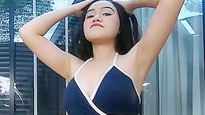 Asian teen in black bikini...